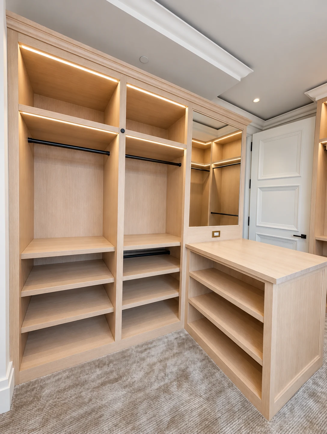 Full-height oak shelving and hanging storage with the open-shelf side of the dresser in the Central Park South dressing room