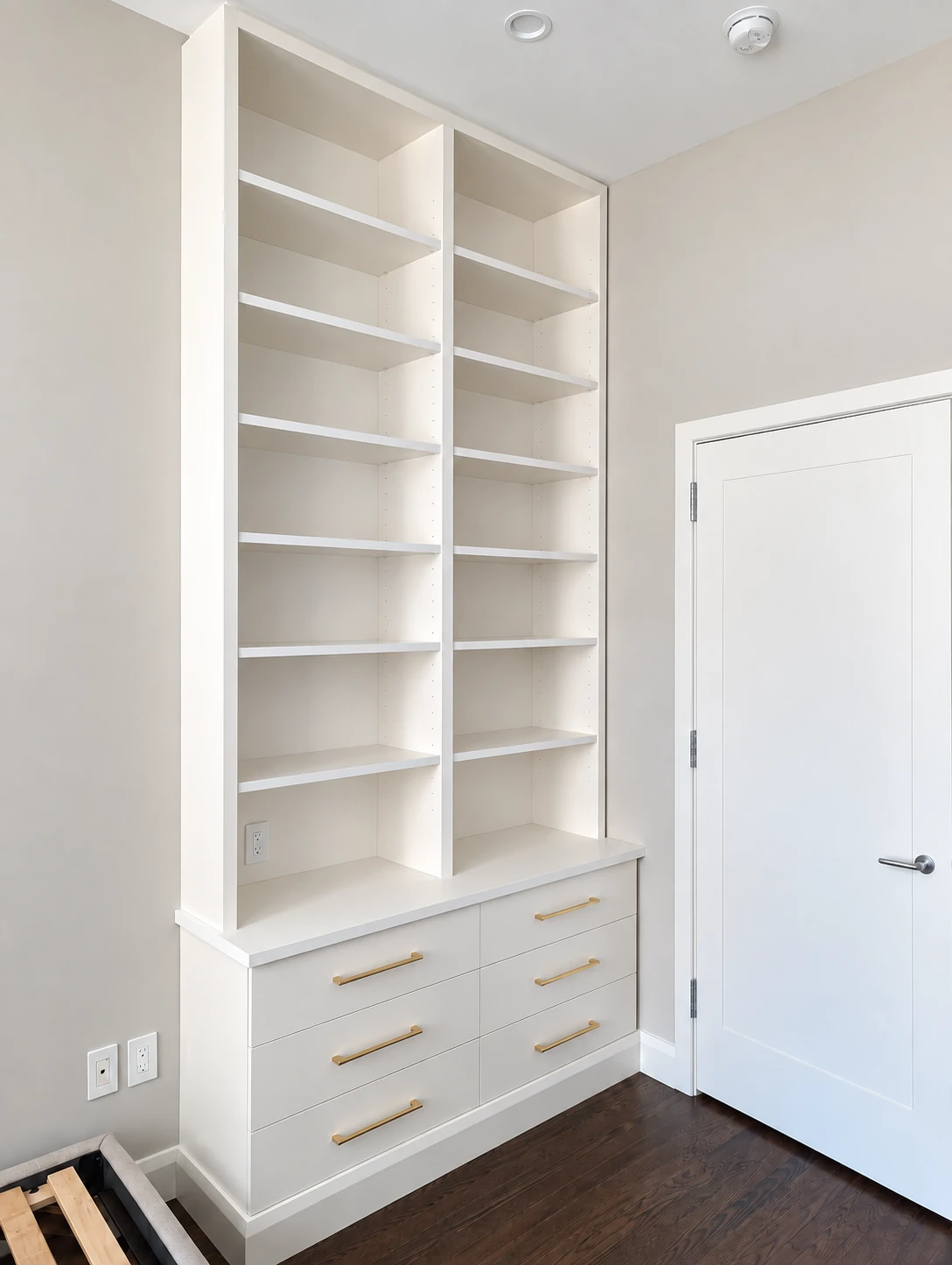 Tall painted bookcase with two shelf columns and lower drawers in Chelsea